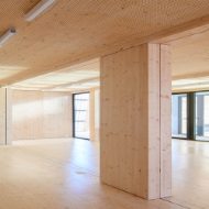 View of an empty room module clad with spruce.
