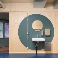 WC/shower/changing room area made of wood of the temporary gymnasium <br/>