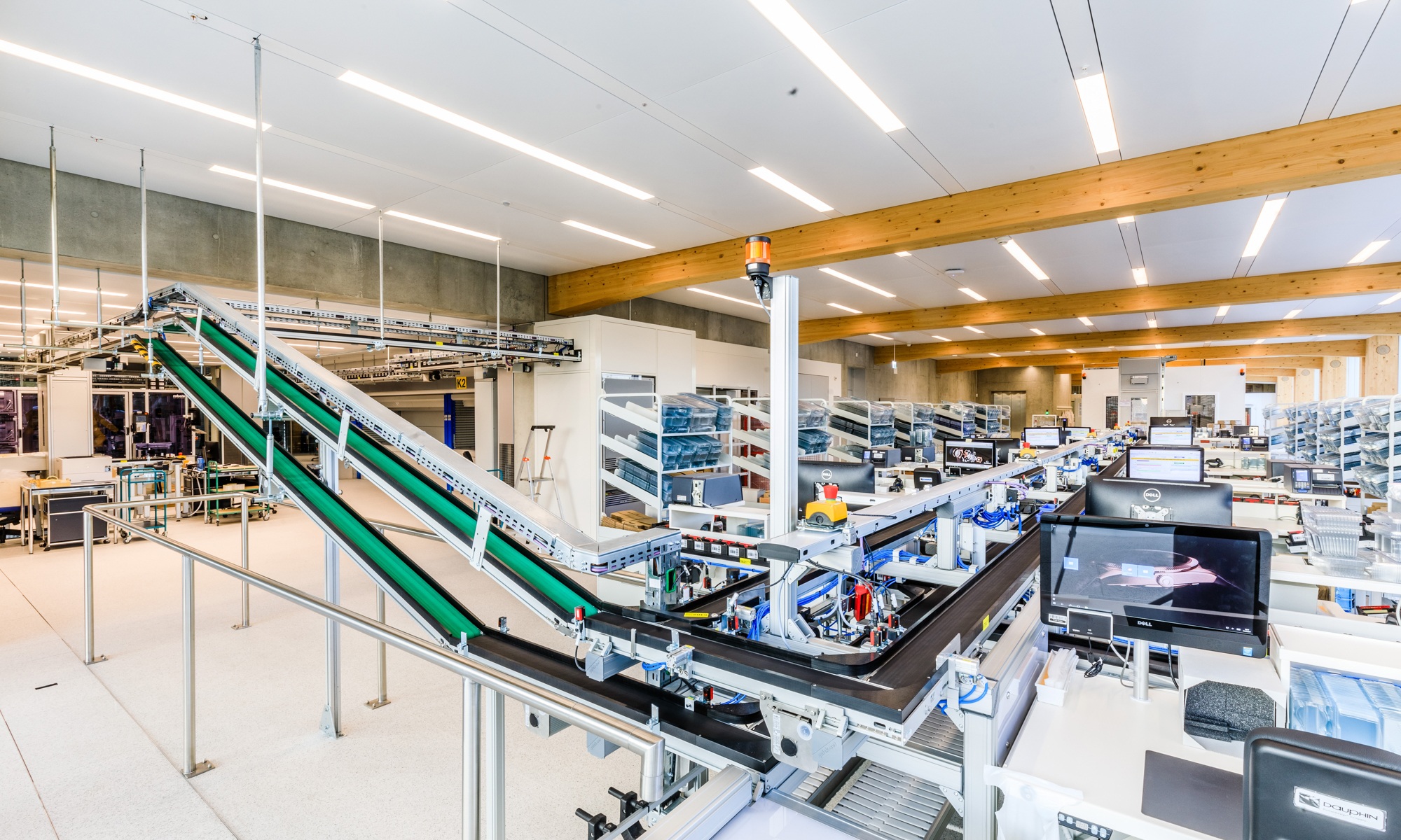Photograph of the bright Omega production workshop with timber roof structure