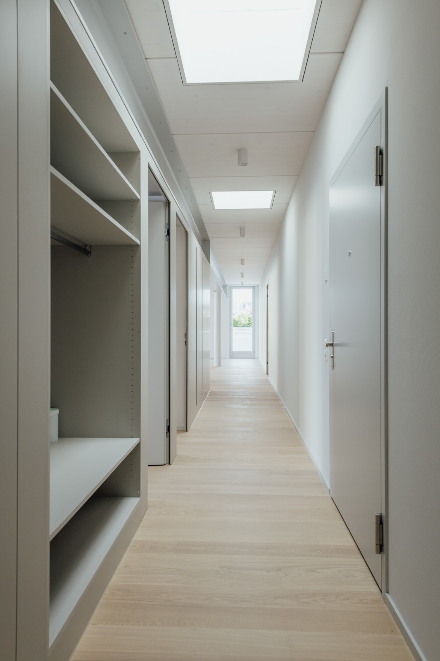Interior view of apartment hallway with built-in cupboards