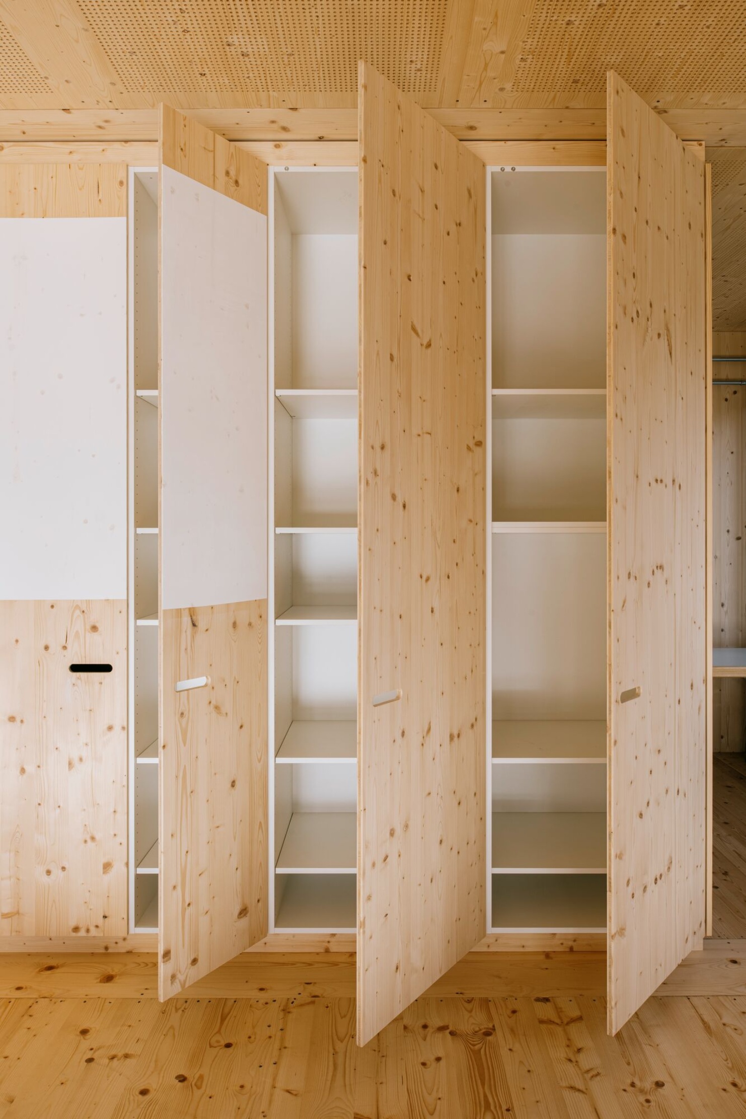 Built-in wooden cupboards in the Sportfeld pavilion