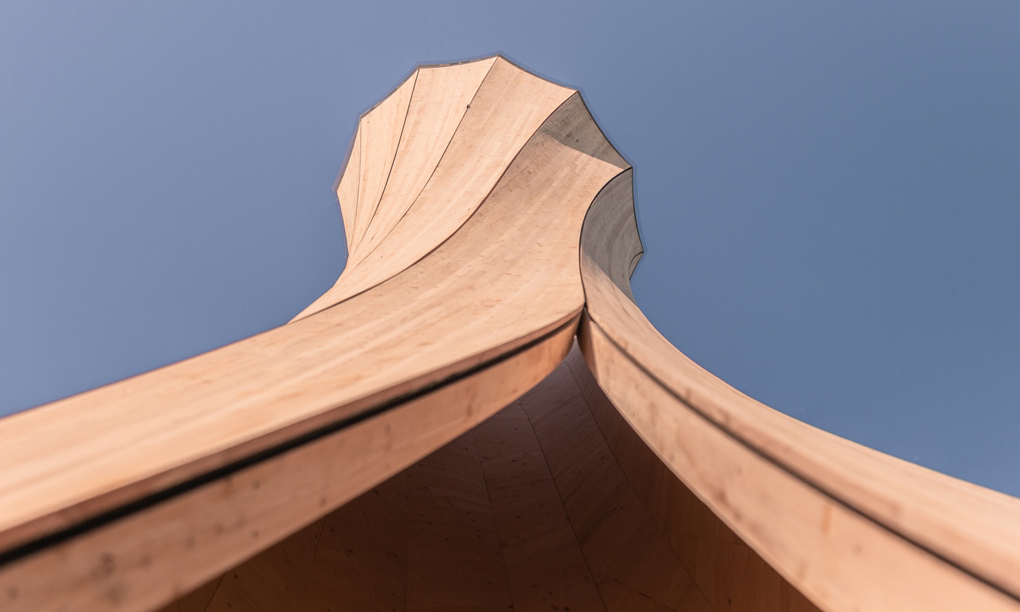 Close-up of the Urbach Tower from below looking towards the sky. The specially formed, gyrating wooden structure is clearly visible