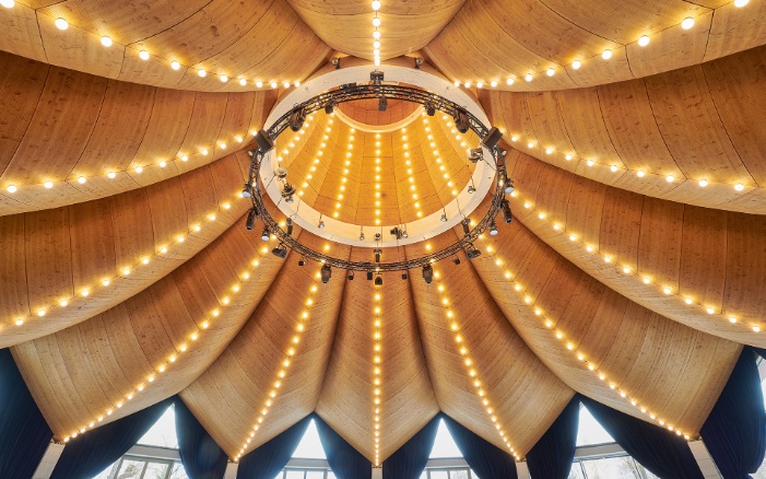 Underside of the curved, Free Form timber roof inside the magician’s hat