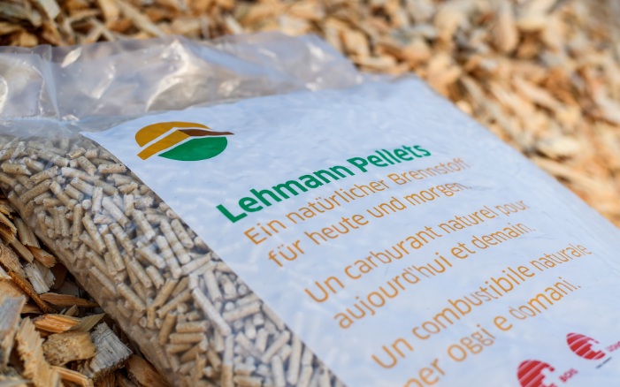 Close-up of a sack with Swiss pellets on a pile of wood chips