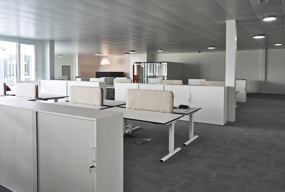 Internal view of an office space with workplaces in the converted Fust industrial building