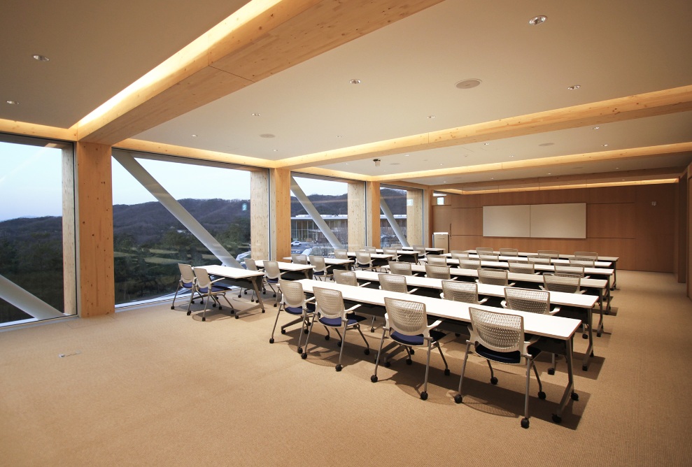 Haesley Nine Bridges Golf Club, interior shot of a classroom in the Learning Centre at dusk, with artificial light