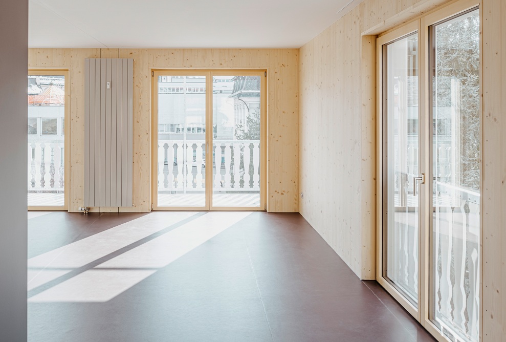 Bright and welcoming living space in the microapartment with timber walls