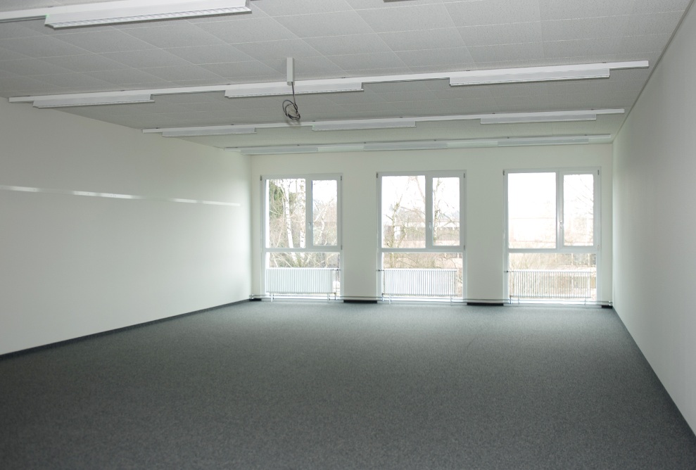 Interior view with windows of a room in the temporary building at the university