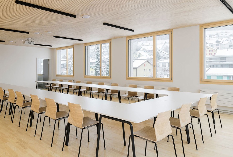 Conference room with timber interior finishing in Mosnang health centre