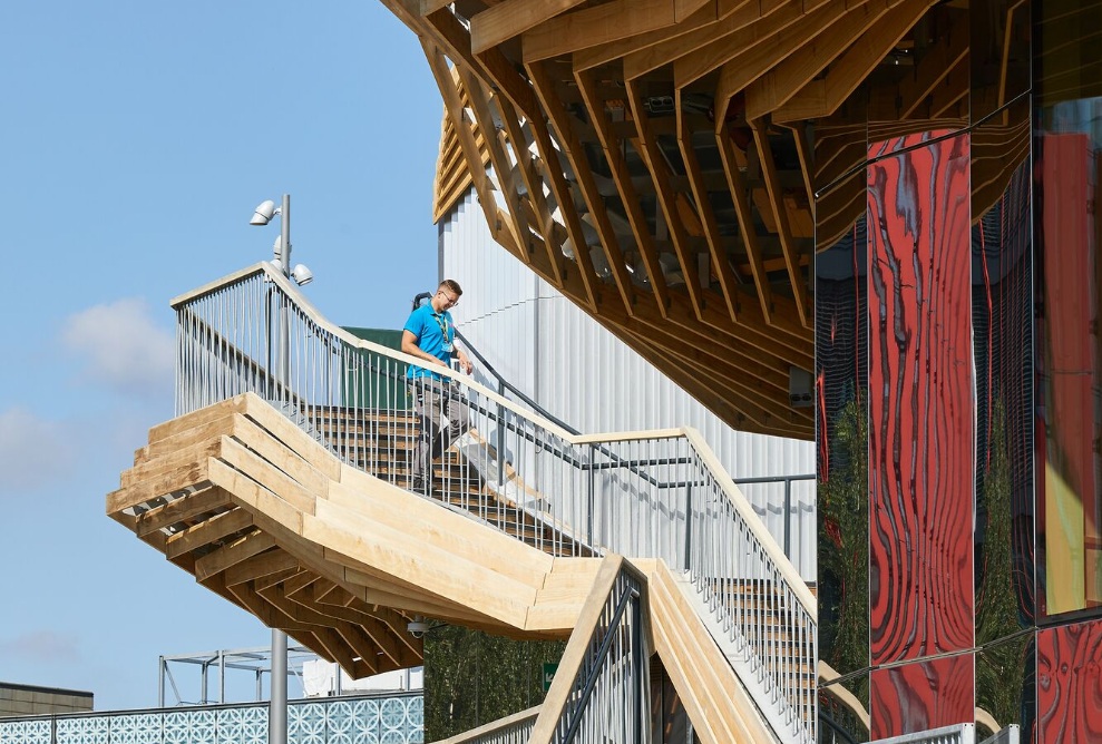 Timber stairway made of several sections on the Pavilion’s facade