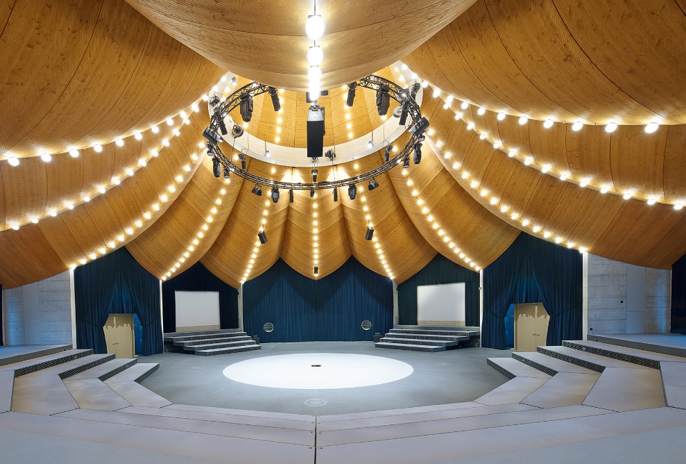 The curved timber roof creates a circus-like atmosphere inside the magician’s hat. 