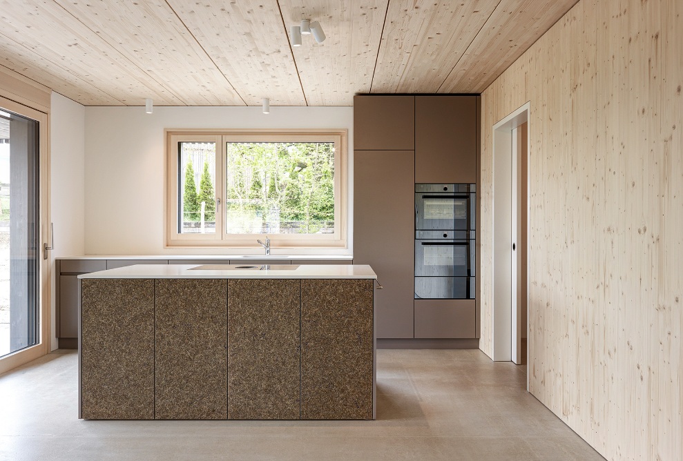 View into the generously designed open kitchen with kitchen island